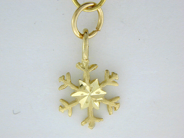 C308  Snowflake with Charm 14kt